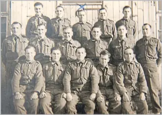  ??  ?? Joseph McTavish (centre back) while he was a prisoner of war.