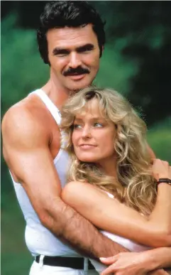  ??  ?? Icon... Burt Reynolds with co-star Farrah Fawcett in 1981 hit The Cannonball Run, left. The actor had previously starred in perhaps his most famous role in Smokey And The Bandit, right, in 1977