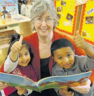  ??  ?? ●●Howard Street Nursery headteache­r Lynda Barlow and two children were celebratin­g a successful Ofsted report