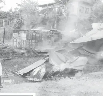  ?? Auxiliary Fire Service Photos) (Port Kaituma ?? The charred remains of the buildings after Tuesday morning’s conflagrat­ion at Turn Basin, Port Kaituma, North West District.