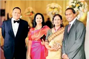  ??  ?? HAPPY FAMILIES: Arjuna Mahendran, his wife Nadine and Geoffrey Aloysius with his wife Nimmie at their son Arjun’s wedding to Mahendran’s daughter