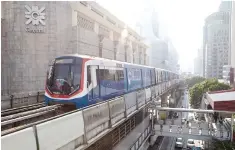  ?? BLOOMBERG ?? A SKYTRAIN, operated by Bangkok Mass Transit System Pcl, travels along an elevated track in Bangkok, Thailand, on Sept. 2.