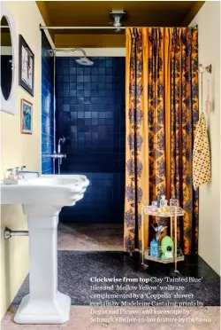  ?? ?? Clockwise from top Clay ‘Tainted Blue’ tiles and ‘Mellow Yellow’ walls are complement­ed by a ‘Coppelia’ shower curtain by Madeleine Castaing; prints by Degas and Picasso and a seascape by Schnack’s father-in-law feature by the basin