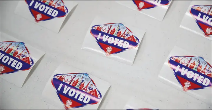  ?? WADE VANDERVORT ?? “I Voted” stickers are laid out for people who vote in Nevada’s presidenti­al preference primary at the Desert Breeze Community Center polling site Feb. 6.