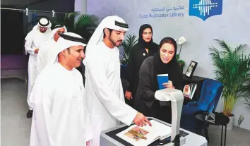  ??  ?? WAM Shaikh Hamdan Bin Mohammad launching the Dubai Audio Library, an initiative undertaken by the Roads and Transport Authority in collaborat­ion with the website Bookshare.org.