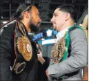  ?? EDWARD DILLER/ICON SPORTSWIRE ?? Unbeaten welterweig­ht champions Keith Thurman (WBA), left, and Danny Garcia (WBC) face off Jan. 18 during an event to hype their title unificatio­n fight on CBS on Saturday at Barclays Center in New York.