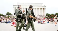  ??  ?? Police officers patrol in front of the Lincoln Memorial before a fireworks show in celebratio­n of the 241st anniversar­y of the Declaratio­n of Independen­ce in Washington, US. — Reuters photo