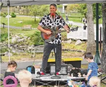  ?? Tyler Sizemore/Hearst Connecticu­t Media file photo ?? Tom Weber performs children’s songs at the Stamford Museum & Nature Center on Sept. 25, 2022. He will perform Dec. 16 at the Greenwich Library’s Marx Family Black Box Theater.