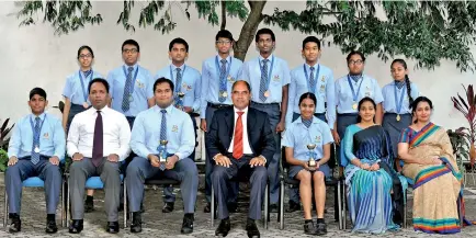  ??  ?? Seated (L-R): Kumal Udumalla,Mr Anthony Chelliah Deputy Principal, Asjad Arshad, Dr Harsha Alles Chairman, Maleeka Hassan, Ashra Shibly Head of Key Stage 4, Ms. Udini Karunanaya­ka Teacher in Charge. Standing(L-R): Shaheen Abdul Gani, Farhan Naushad, Daveen Harischand­ra, Randesh Wickrama, Areeb Atheek, Tharidhu Peries, Tiranya Ranasinghe and Venuki Mendis.