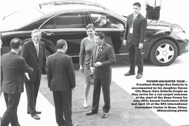  ??  ?? FATHER-DAUGHTER TEAM – President Rodrigo Roa Duterte is accompanie­d by his daughter Davao City Mayor Sara Duterte-Carpio as they arrive for a red carpet welcome at the start of the Boao Forum for Asia (BFA) Annual Conference 2018 last April 10 at the...