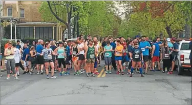  ?? RECORD FILE PHOTO ?? Participan­ts in the 2017Joseph G. Manupella Memorial Run get ready to start the race.