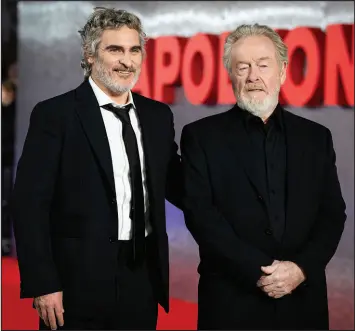  ?? SCOTT GARFITT / INVISION / ASSOCIATED PRESS FILE (2023) ?? Actor Joaquin Phoenix, left, and filmmaker Ridley Scott arrive at the UK premiere of the film “Napoleon” on Nov. 15, in London.