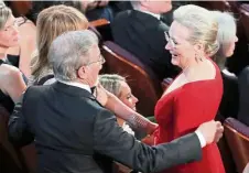 ?? — Reuters ?? Director Steven Spielberg (left) catches up with his The Post star, Meryl Streep.