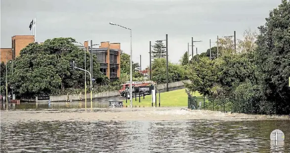  ?? LAWRENCE SMITH/FAIRFAX NZ ?? The Tasman Tempest caused huge downpours and major flooding in New Lynn, Auckland, causing emergency service call-outs to spike.