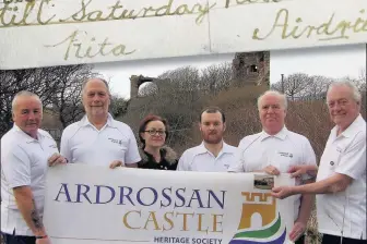  ??  ?? Take two Members of Ardrossan Heritage Society, including Amanda Simpson, third left, beside the town’s castle