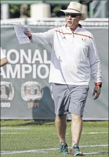  ?? ALAN DIAZ / ASSOCIATED PRESS ?? Miami coach Mark Richt sports a real South Florida look as he leads his first spring practice at his alma mater last week.