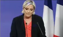  ?? THIERRY CHESNOT, GETTY IMAGES ?? Presidenti­al candidate Marine Le Pen, of the far-right National Front party, makes a statement after being defeated on Sunday.