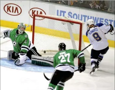  ?? MATT STRASEN — THE ASSOCIATED PRESS ?? St. Louis Blues left wing Jaden Schwartz (9) puts the puck past Stars goalie Kari Lehtonen during a Dec. 29 game in Dallas. Schwartz, the younger brother of Mandi Schwartz, the Yale women’s hockey player who lost her battle with leukemia in 2011, and...