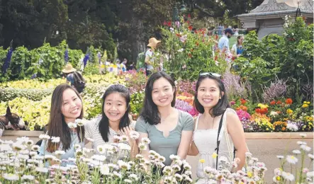  ?? Picture: Bev Lacey ?? BLOOMING GREAT: Enjoying this year’s Carnival of Flowers were Singaporea­n exchange students (from left) Germaine Foo, Angie Koh, Tan Yan Ling, Viviana Lee.