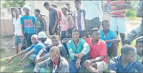  ?? (Courtesy pic) ?? A section of emaSwati and Mozambican national cane cutters pictured at the Ngomane Village. However, the people in this picture are not directly linked to the article.