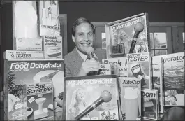  ?? REED SAXON — THE ASSOCIATED PRESS FILE ?? Ron Popeil, the man behind those late-night, rapid-fire television commercial­s that sell everything from the Mr. Microphone to the Pocket Fisherman to the classic Veg-a-Matic, sits surrounded by his wares in his office in Beverly Hills Ron Popeil