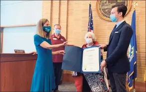  ?? Adam Hushin / Hearst Connecticu­t Media ?? U.S. Coast Guard veteran Mary R. Stewart, 100, center, aunt of Lt. Gov. Susan Bysiewicz, left, as well as Middletown Mayor Ben Florsheim, right, participat­e in a Quilt of Valor ceremony Thursday at City Hall.