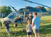  ?? JANE BOKUN/POST-TRIBUNE ?? First Family Fest attendees were treated to a helicopter landing by the Lake County Sheriff’s Department Aviation Unit.