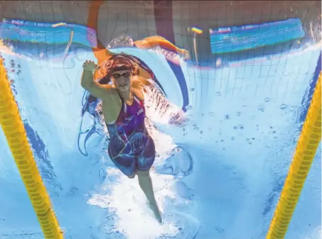  ?? Francois-Xavier Marit / AFP / Getty Images ?? Stanford’s Katie Ledecky powers through her lane on her way to gold in the women’s 400-meter freestyle in Budapest.