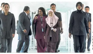  ??  ?? Time out: Wan Azizah during a break at Parliament in Kuala Kumpur. — Bernama