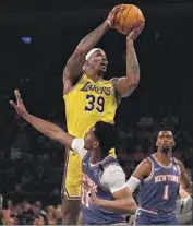  ?? Elsa Garrison Getty Images ?? DWIGHT HOWARD of the Lakers says he must “really make the dunk contest fun for the fans.”