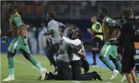  ??  ?? Aliou Cissé celebrates Senegal’s dramatic semi-final victory against Tunisia in Cairo. Photograph: Hassan Ammar/AP