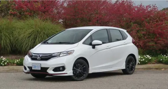  ?? JIM KENZIE PHOTOS FOR THE TORONTO STAR ?? The subcompact, four-door hatchback 2018 Honda Fit starts at $15,190. “The 2018 model is significan­tly face-lifted from last year, giving it a fresh and handsome look,” Jim Kenzie writes.