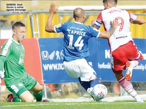  ?? PICTURE: TGS Photo ?? BARRIER: Scott Davies in action against Stevenage