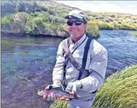  ?? ?? A well placed elk hair caddis under the bank provided a nice rainbow for Matt O’Brian of Los Angeles.