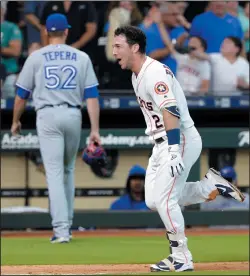  ?? AP PHOTO/ MICHAEL WYKE ?? Houston Astros Alex Bregman (2) celebrates as he runs the bases as Toronto Blue Jays relief pitcher Ryan Tepera (52) heads to the dugout after Bregman's two run home run to win 76 during the ninth inning of a baseball game Wednesday in Houston.