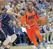  ?? [AP PHOTO] ?? Oklahoma City guard Dennis Schroder, right, dribbles past Dallas’ Devin Harris during Sunday night’s game at American Airlines Center. Dallas beat OKC, 105-103.