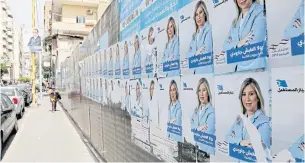  ?? AFP ?? Campaign posters for the upcoming Lebanese parliament­ary election are shown hanging in the Tariq Jedideh district of Beirut on April 3.