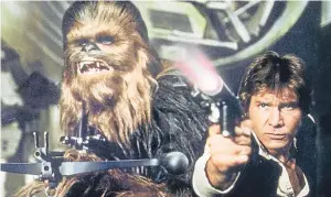  ?? Picture: Lucasfilm. ?? Peter Mayhew as Chewbacca and Harrison Ford as Han Solo in Star Wars Episode IV – A New Hope released 40 years ago.