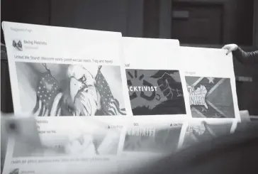  ?? ERIC THAYER The New York Times, file 2017 ?? Posters of Facebook posts by Russians attempting to influence the 2016 election are shown during a hearing on Capitol Hill in Washington. A voter-suppressio­n effort was focused particular­ly on Bernie Sanders supporters and African Americans, urging them to shun Hillary Clinton in the general election and either vote for the Green Party’s Jill Stein or stay home.