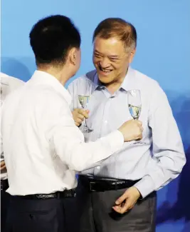  ??  ?? Chairman of Dalian Wanda Group Wang Jianlin (left) and Chairman of R&F Properties Li Silian attend a strategic cooperatio­n signing ceremony in Beijing. (Reuters)