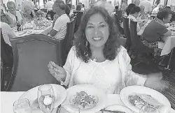  ?? PROVIDED BY NARGIS KHERAJ ?? Nargis Kheraj, from New Brunswick, Canada, is an avid cruiser. Here, she enjoys a meal on a cruise in 2019.