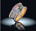  ?? ?? The gold and enamel mourning ring.