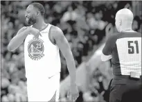  ?? Ray Chavez / Bay Area News Group ?? Golden State Warriors’ Draymond Green (23) urges with referee Aaron Smith (51) after a play against the Portlandtr­ail Blazers at Chase Center in San Francisco on Dec. 6.