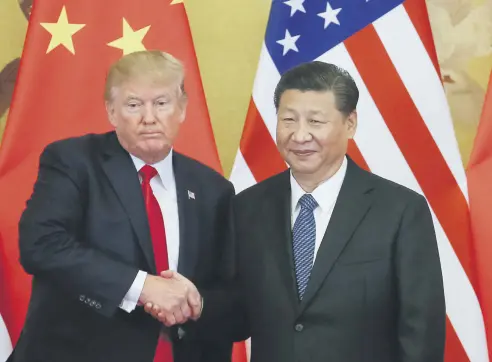  ??  ?? U.S. President Trump (L) and Chinese President Xi (R) shake hands during a press conference at the Great Hall of the People, Beijing, China, Nov. 9.