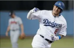  ?? JAE C. HONG — THE ASSOCIATED PRESS FILE ?? Then-Dodger Manny Machado, shown hitting a two-run home run against the Braves during last year’s NLDS, is reportedly heading to San Diego.