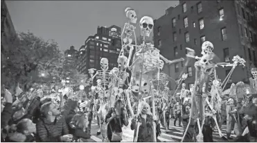  ?? Ap-Frank Franklin II, File ?? Revelers march during the Greenwich Village Halloween Parade in New York on Oct. 31, 2019.