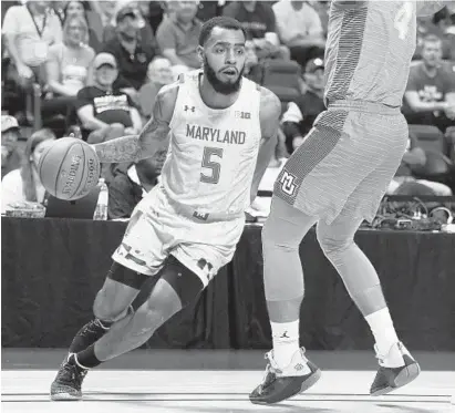  ?? SCOTT AUDETTE/AP ?? Maryland’s Eric Ayala drives against Marquette on Sunday. Ayala was in the starting lineup for the first time since the season opener.