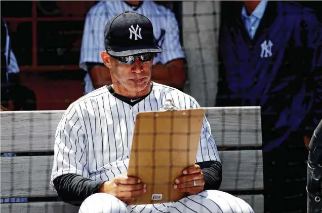  ?? Alex Trautwig / Getty Images ?? As an industrial engineerin­g major at Northweste­rn, Yankees skipper Joe Girardi says, “I was always a numbers guy,” first as a catcher before managing.