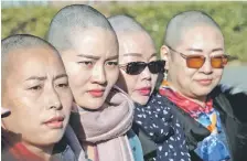  ?? — AFP photo ?? (From left) Yuan Shanshan, Li Wenzu, Liu Ermin and Wang Qiaoling speak to the media after they shaved their heads to protest the detention of their husbands, detained during the 709 crackdown, in Beijing.