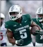  ?? ASSOCIATED PRESS FILE PHOTO ?? Michigan State’s Nate Carter (5) runs for a touchdown in 2023.